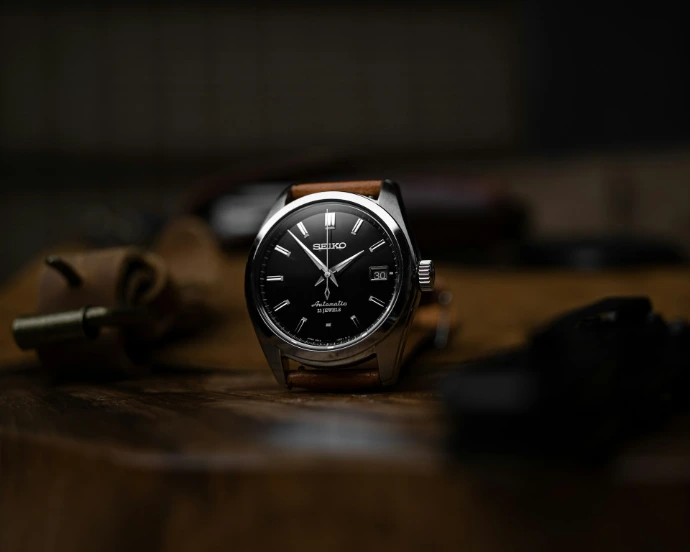 silver and black analog watch